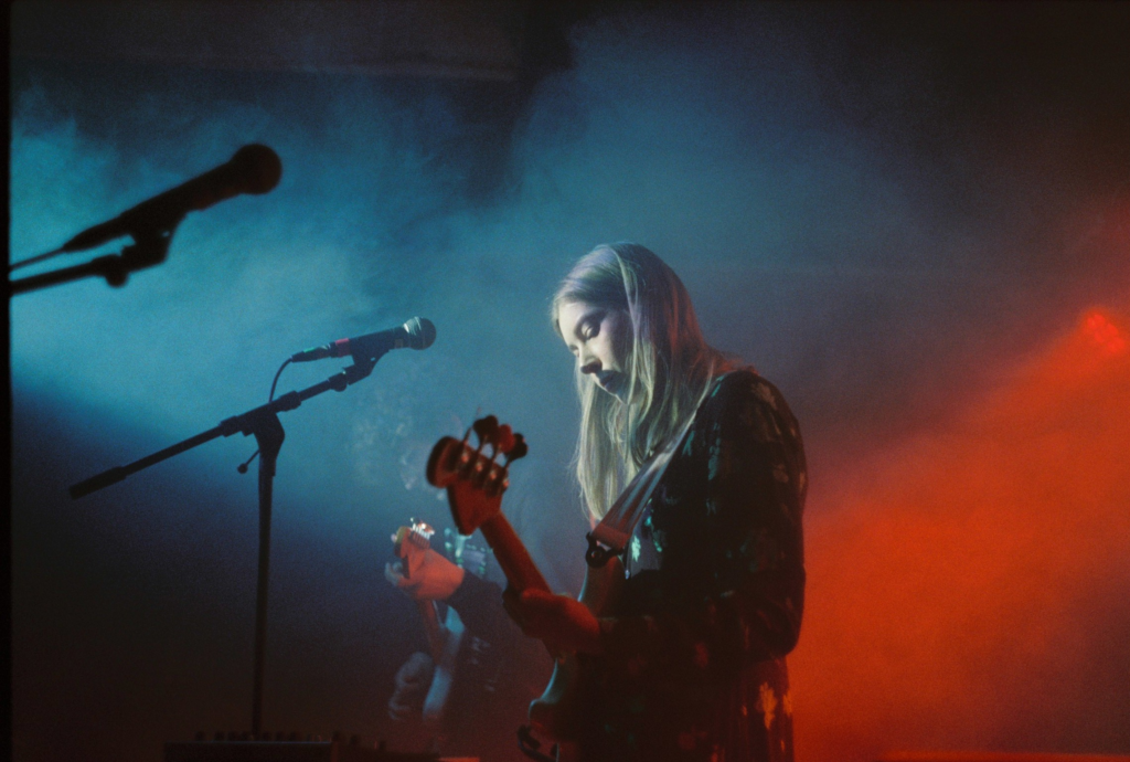 A girl playing guitar at the concert